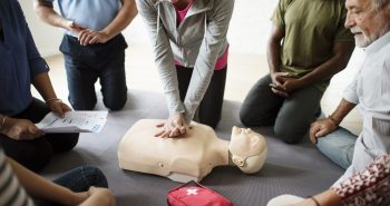 Group of diverse people in cpr training class